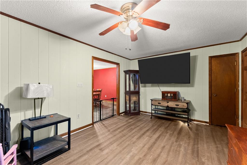 1527 Gold Mine Road Dawsonville, GA 30534 - Photo 9 of 39 a living room with furniture and a flat screen tv