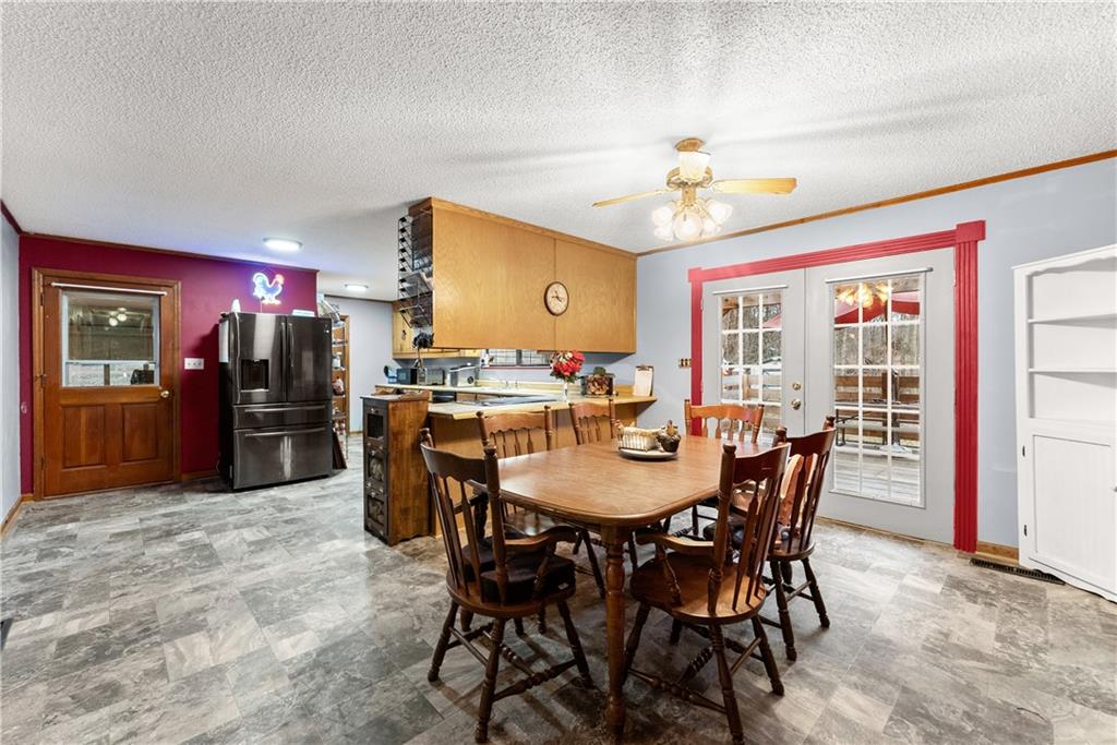 1527 Gold Mine Road Dawsonville, GA 30534 - Photo 10 of 39 a view of a dining room with furniture window and wooden floor
