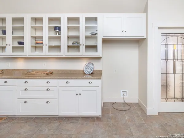a kitchen with a table and chairs