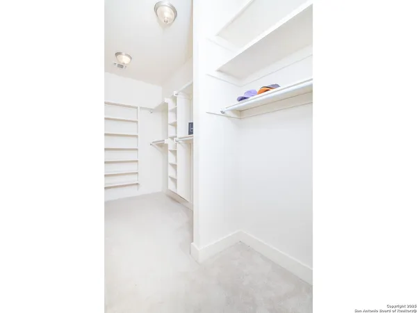 a view of an empty room with shelves