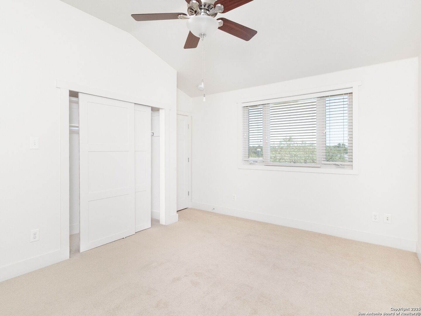 800 Steapp Lane Mason, TX 76856 - Photo 24 of 47 an empty room with a window and a fan