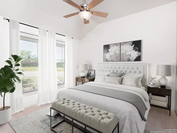 an empty room with windows and fan