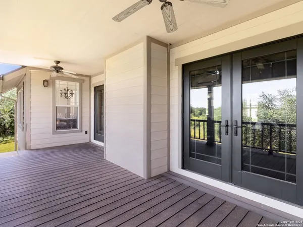 a view of field with tall trees