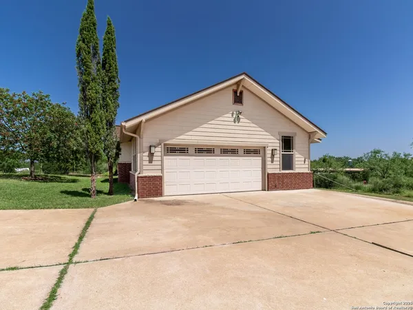 a front view of a house with yard