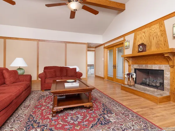 a living room with furniture and a fireplace