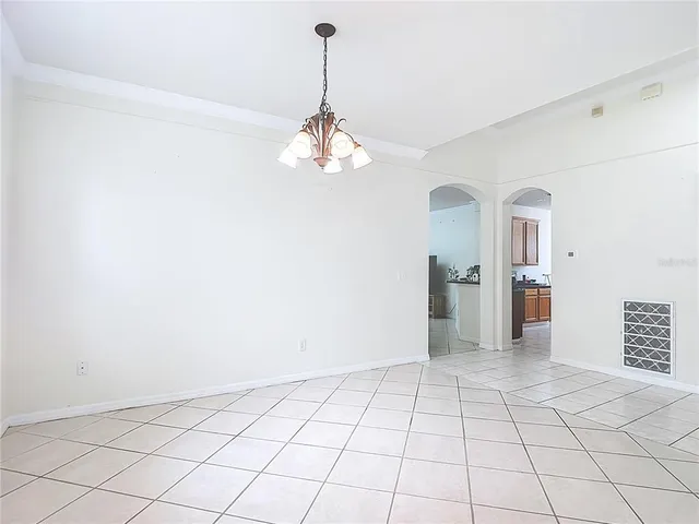 a view of an empty room and a window