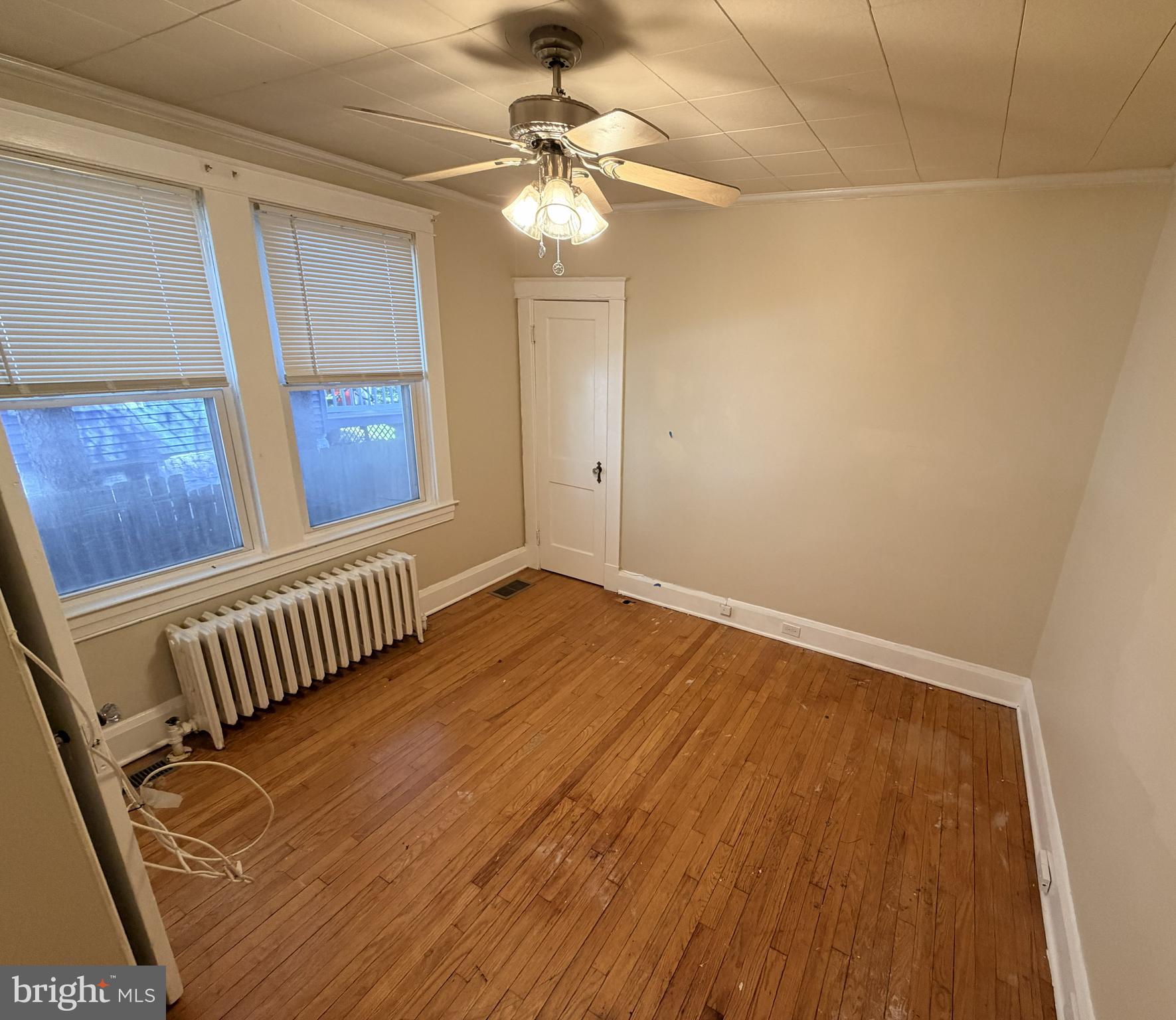 506 Cedarcroft Road Baltimore, MD 21212 - Photo 7 of 16 a view of a room with wooden floor and fan