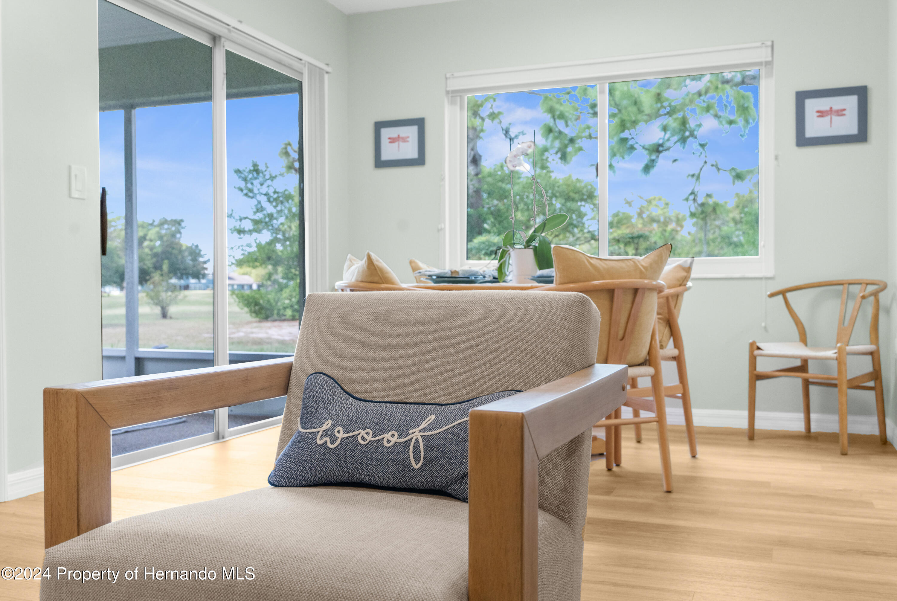 7566 St Andrews Boulevard Weeki Wachee, FL 34613 - Photo 20 of 38 a living room with furniture and a large window