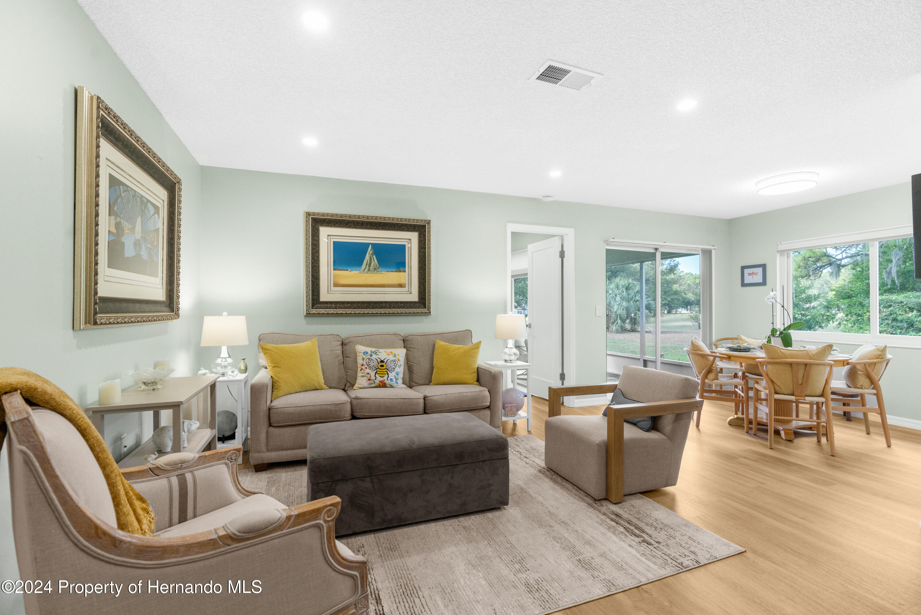 7566 St Andrews Boulevard Weeki Wachee, FL 34613 - Photo 22 of 38 a living room with furniture and a large window