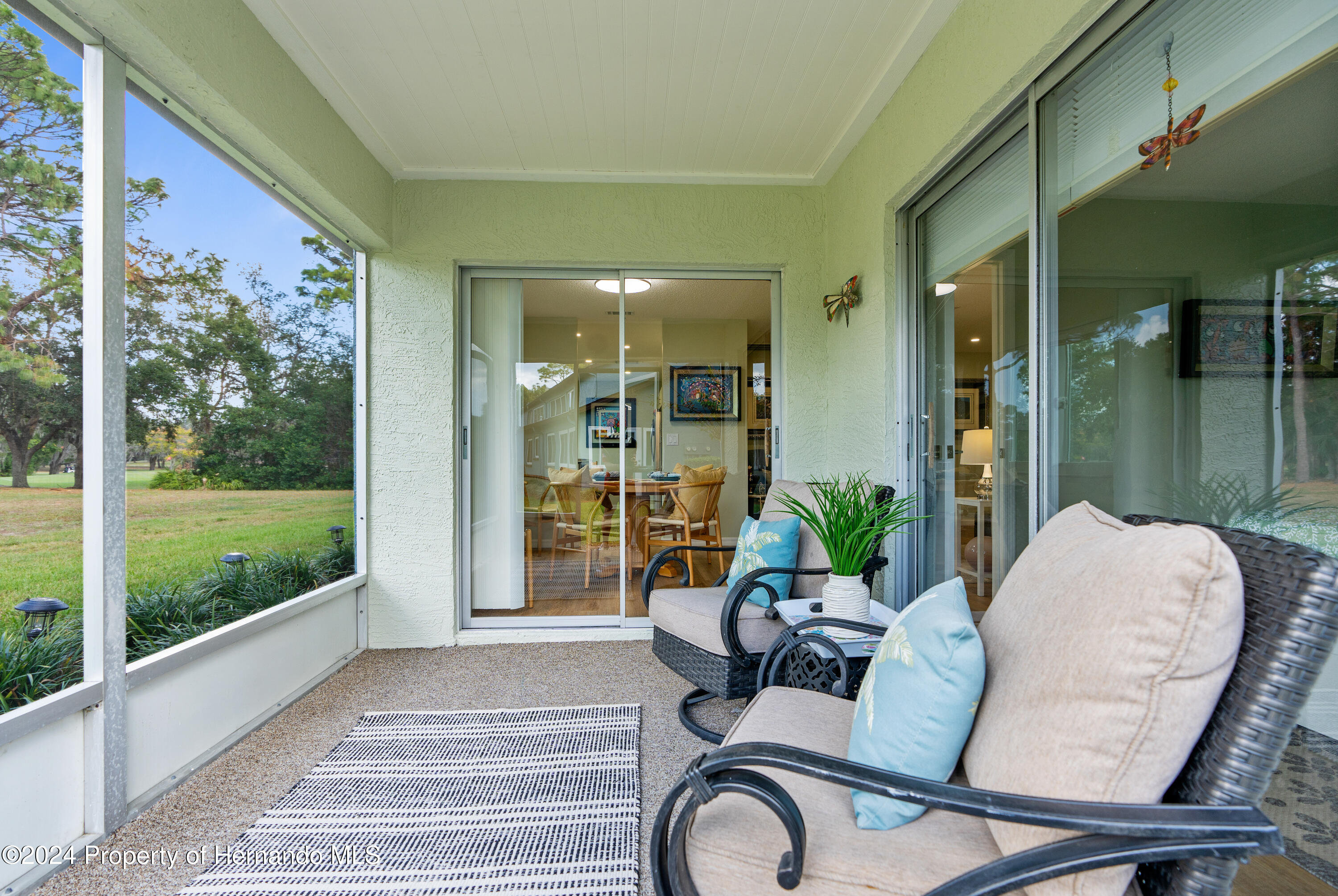7566 St Andrews Boulevard Weeki Wachee, FL 34613 - Photo 28 of 38 a living room filled with furniture