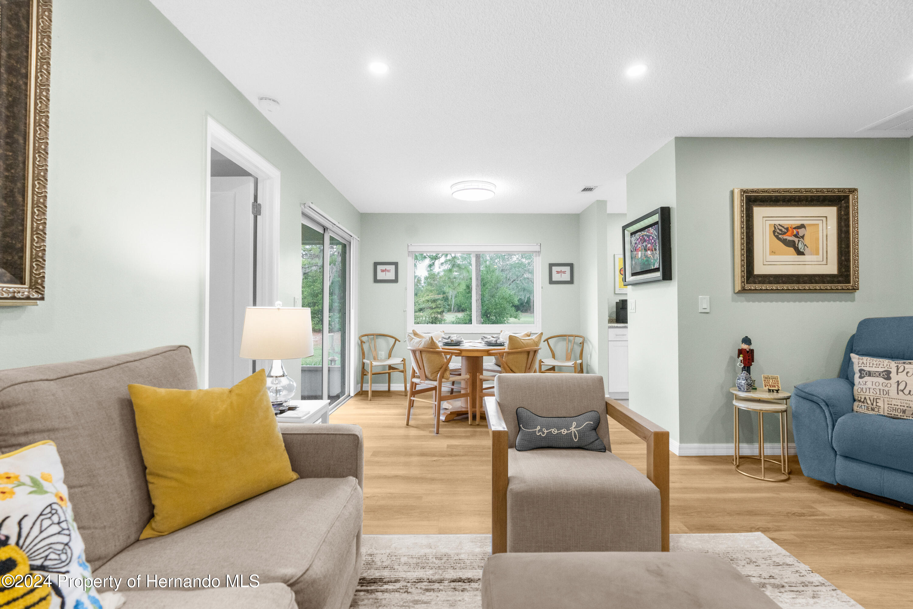 7566 St Andrews Boulevard Weeki Wachee, FL 34613 - Photo 29 of 38 a living room with furniture and a large window