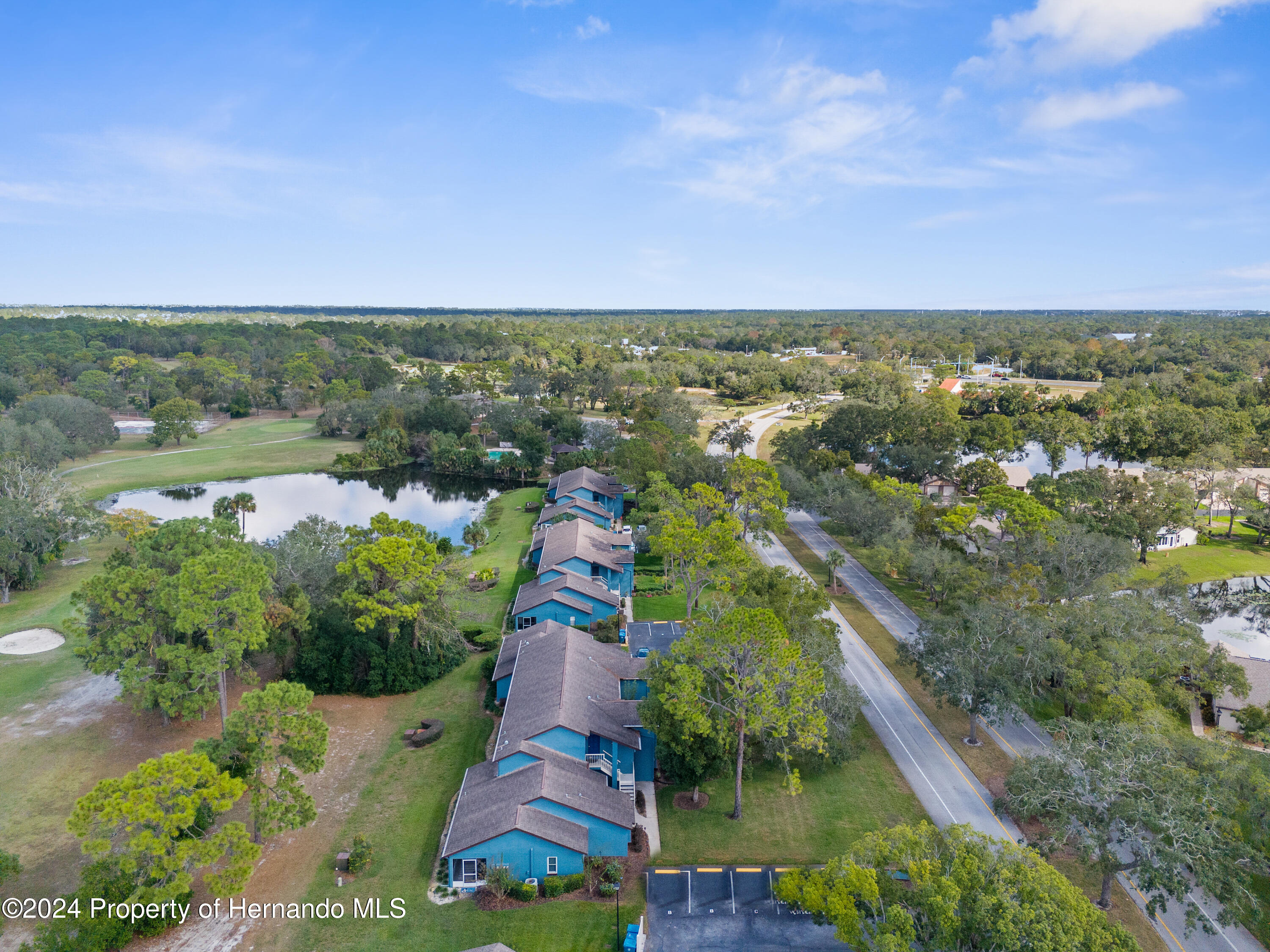 7566 St Andrews Boulevard Weeki Wachee, FL 34613 - Photo 35 of 38 an aerial view of a city with lots of residential buildings