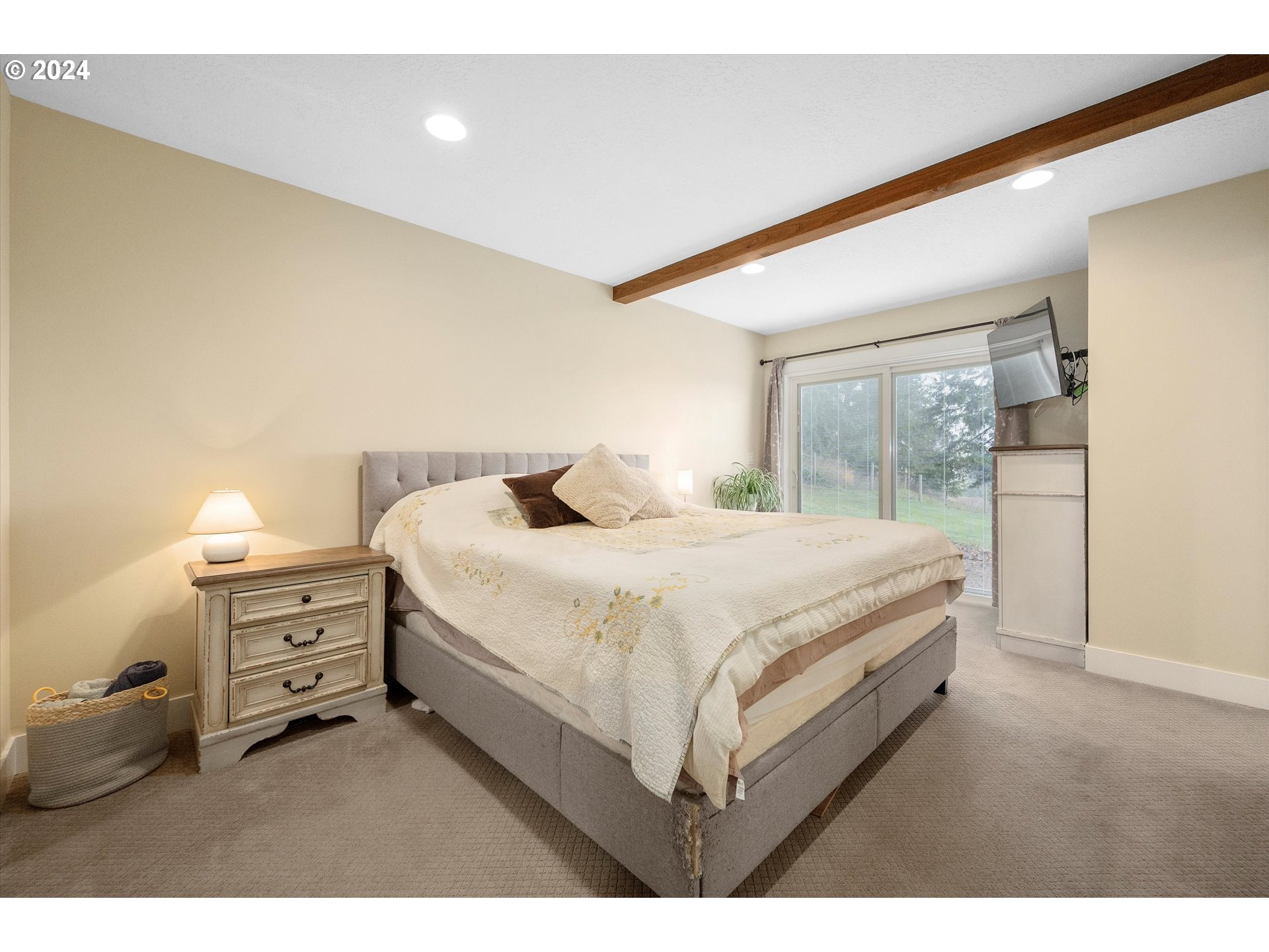 7625 Southeast Seawood Road Amity, OR 97101 - Photo 19 of 48 a bedroom with a bed and a dresser