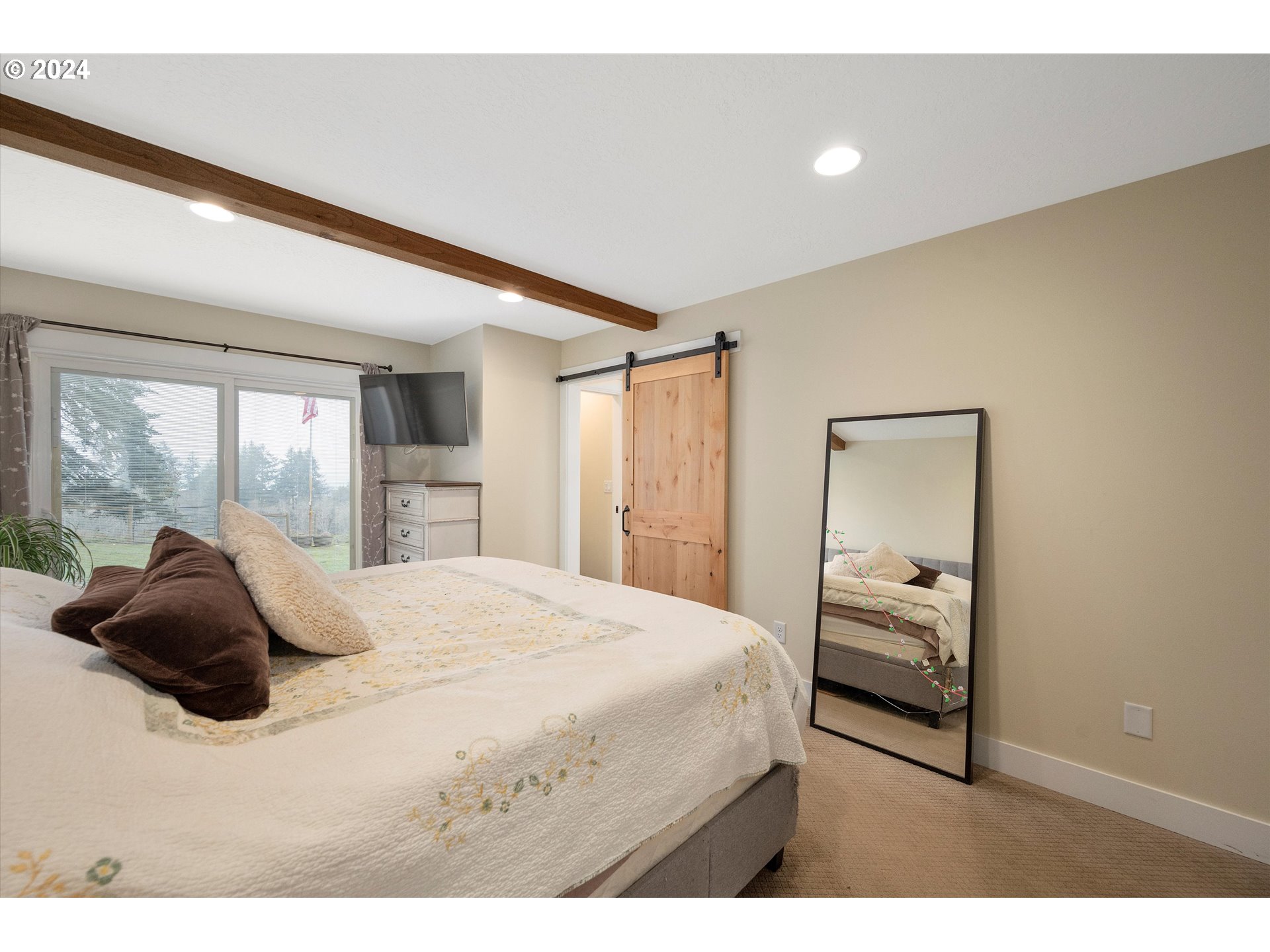7625 Southeast Seawood Road Amity, OR 97101 - Photo 21 of 48 a bedroom with a bed and a large window