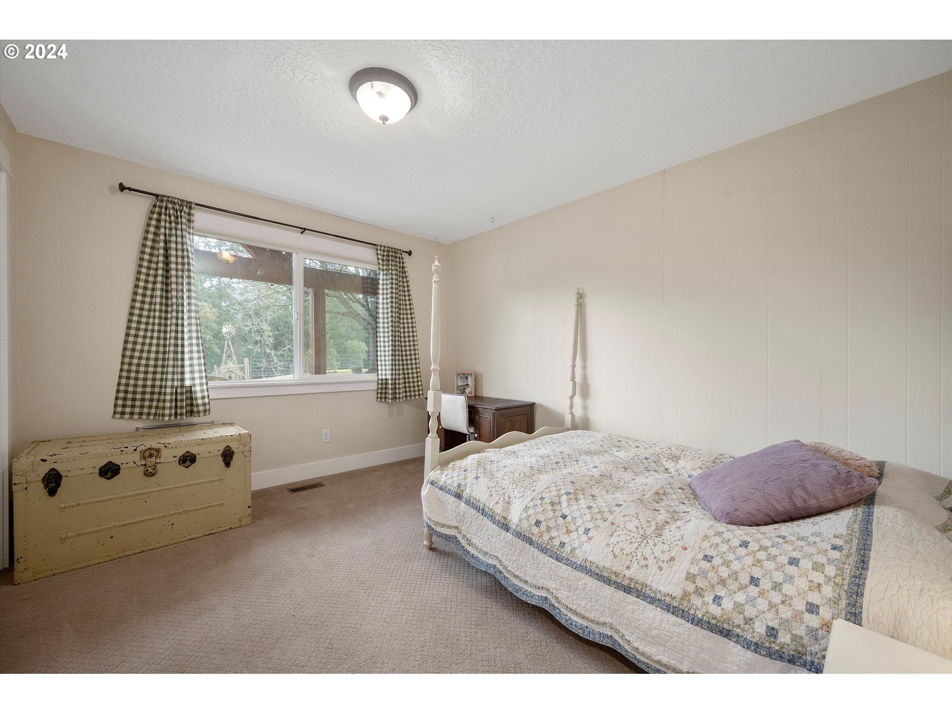 7625 Southeast Seawood Road Amity, OR 97101 - Photo 25 of 48 a bedroom with a bed and a window
