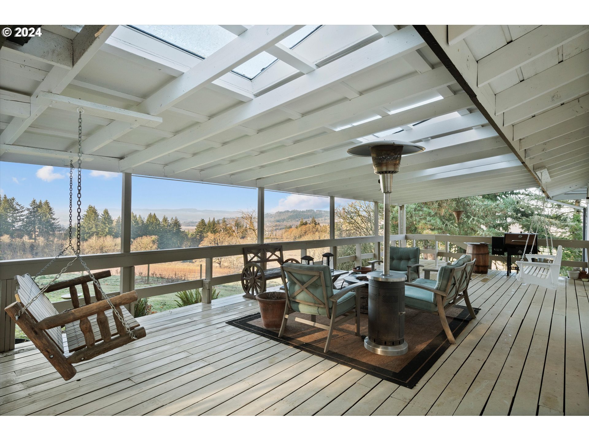 7625 Southeast Seawood Road Amity, OR 97101 - Photo 28 of 48 a view of a balcony with chairs and wooden floor