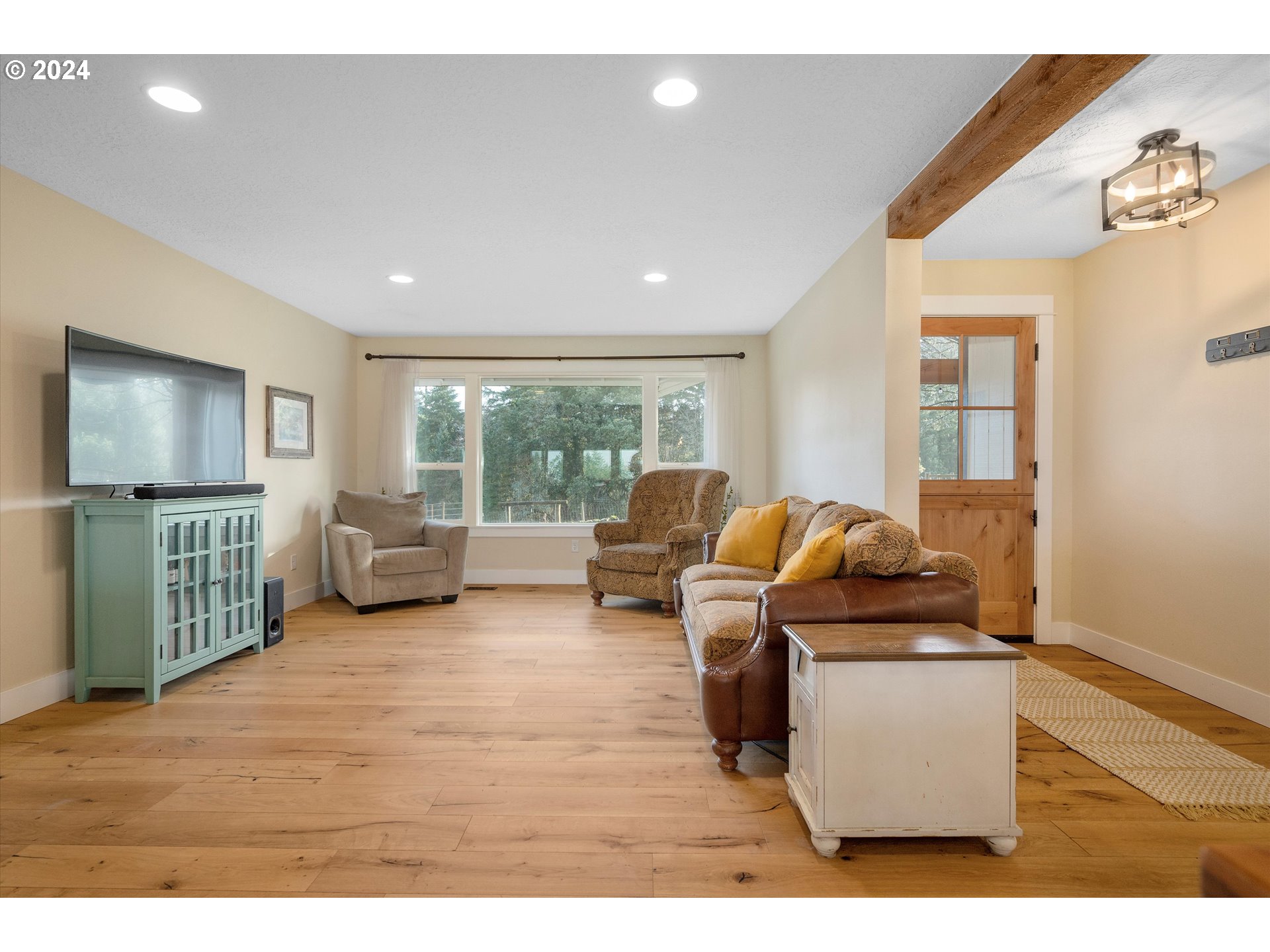 7625 Southeast Seawood Road Amity, OR 97101 - Photo 5 of 48 a living room with furniture window and a flat screen tv