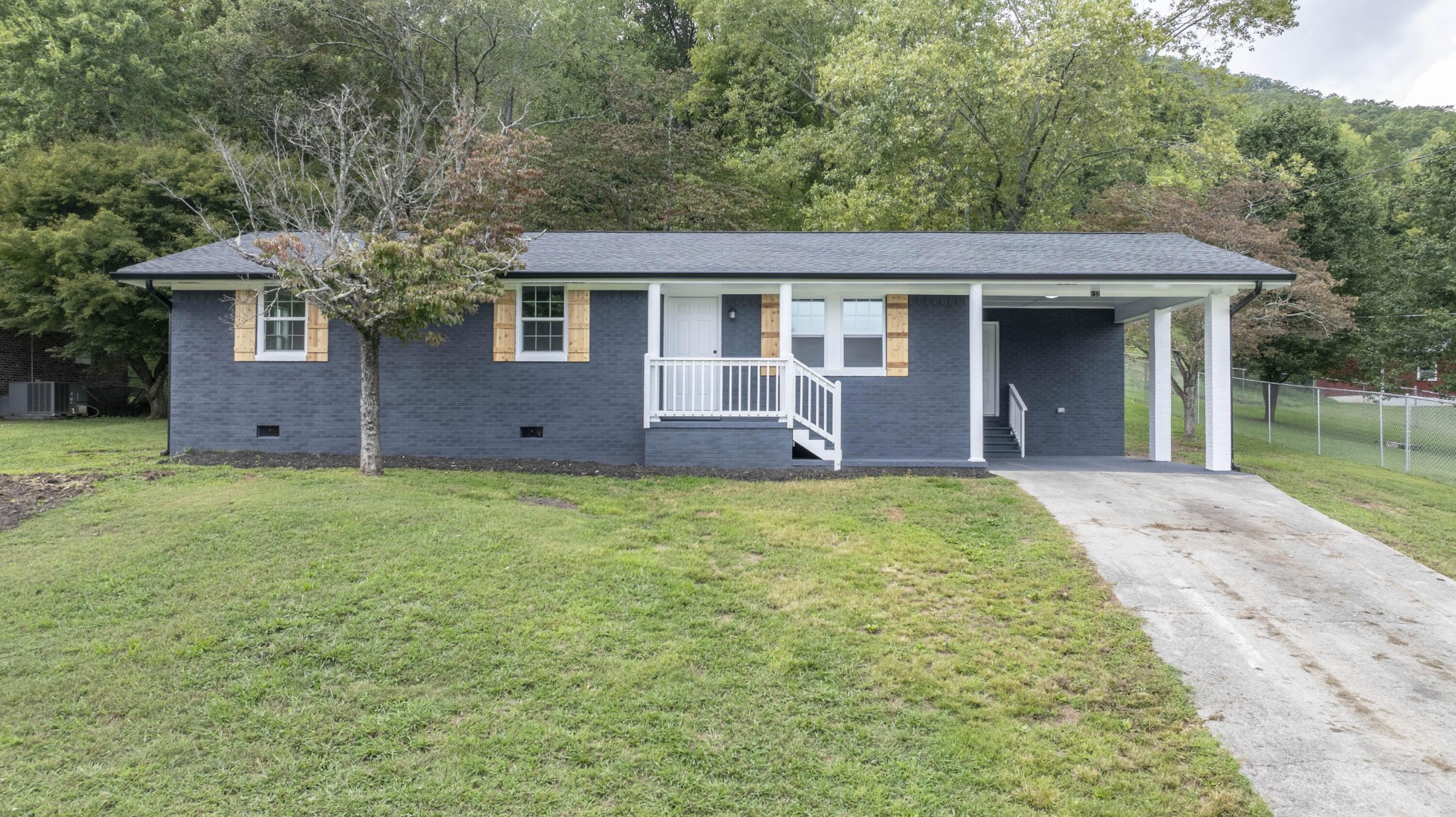 132 Walnut Street Spring City, TN 37381 - Photo 1 of 26 front view of a house with a yard