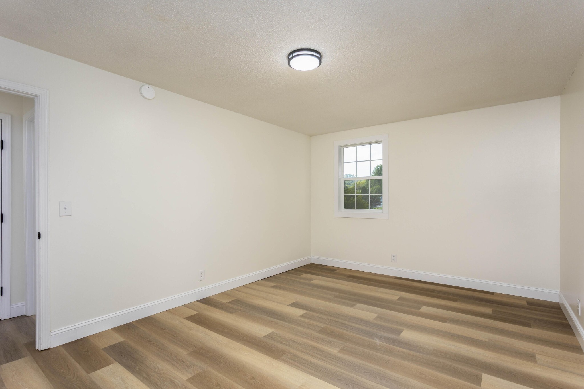 132 Walnut Street Spring City, TN 37381 - Photo 16 of 26 a view of a room with wooden floor and windows