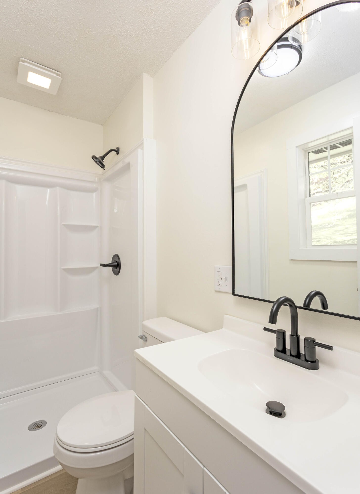 132 Walnut Street Spring City, TN 37381 - Photo 17 of 26 a bathroom with a sink a toilet and shower