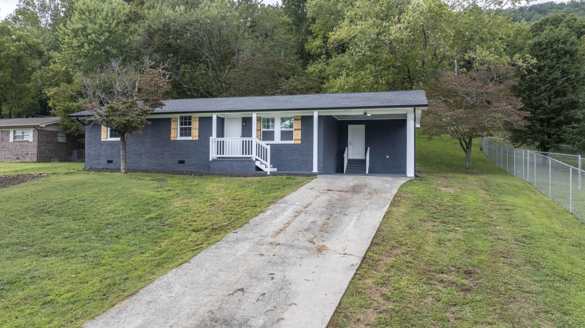 132 Walnut Street Spring City, TN 37381 - Photo 25 of 26 front view of a house with a yard