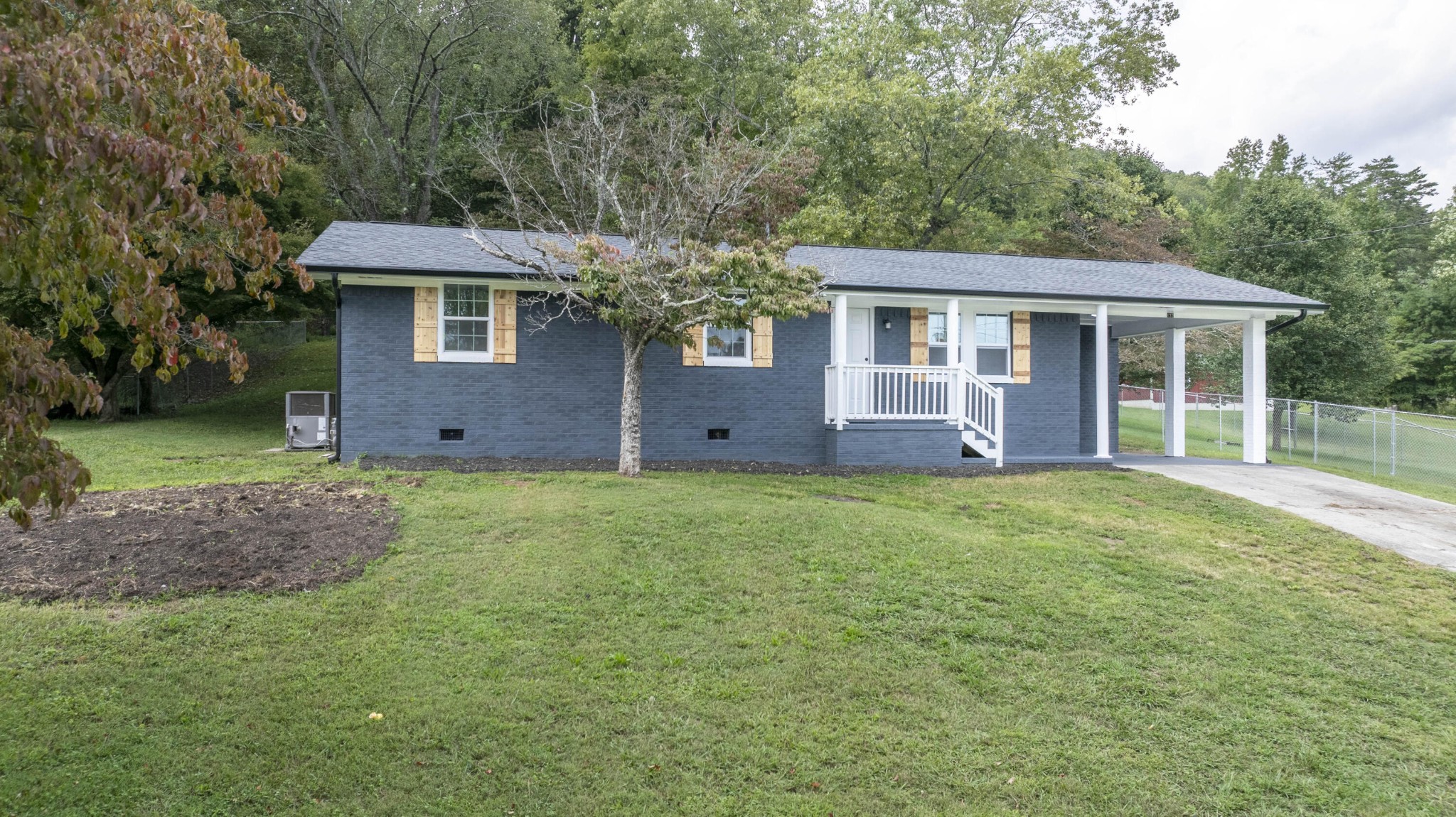 132 Walnut Street Spring City, TN 37381 - Photo 26 of 26 a view of a house with yard and garden