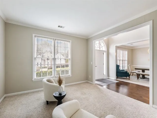 a kitchen with granite countertop a sink a stove and cabinets