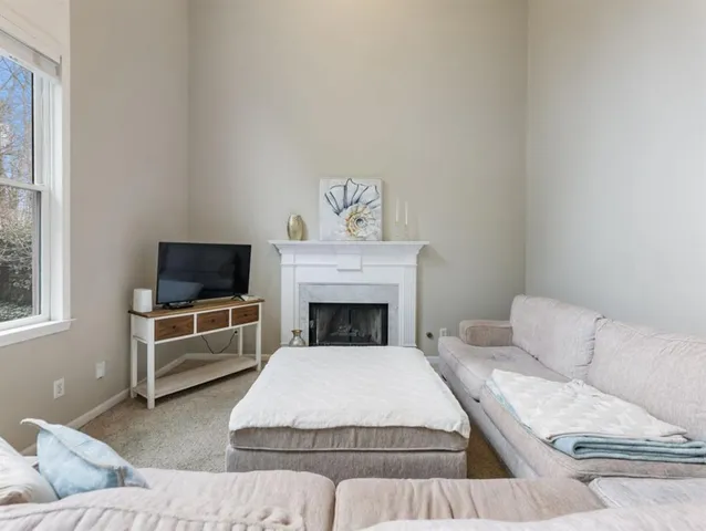 a kitchen with stainless steel appliances granite countertop a sink stove refrigerator and cabinets