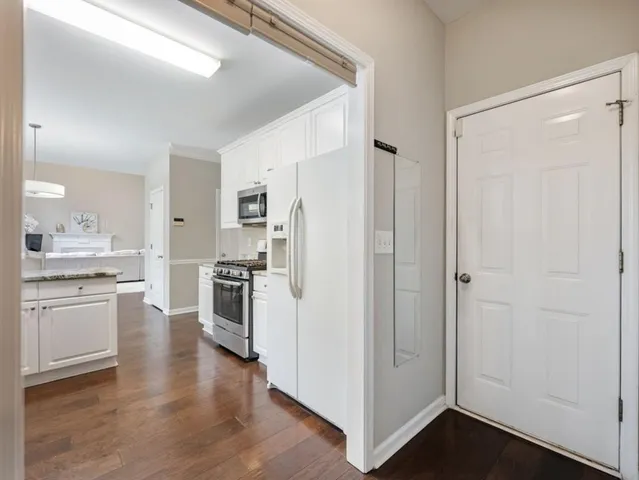 a view of a hallway with a white walls