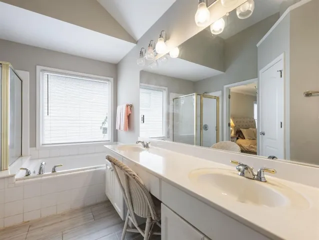 a view of a house with backyard porch and sitting area