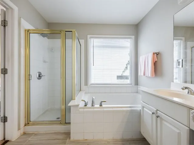 a pathway of a house with a yard