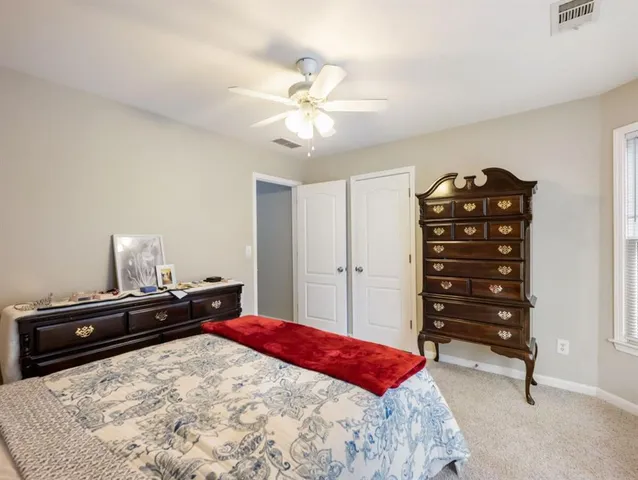 a view of a backyard with large trees