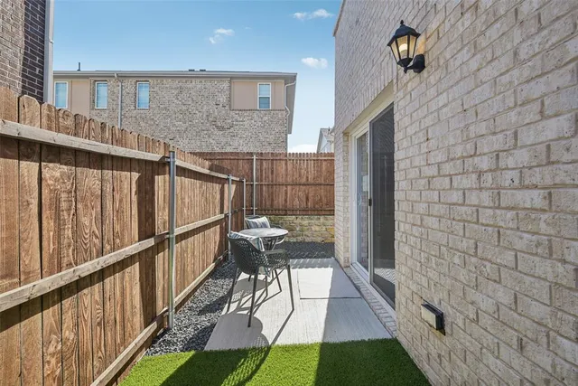 a view of backyard with seating space