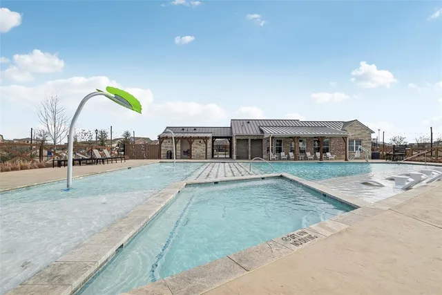 a open kitchen with stainless steel appliances granite countertop a stove a sink and a refrigerator