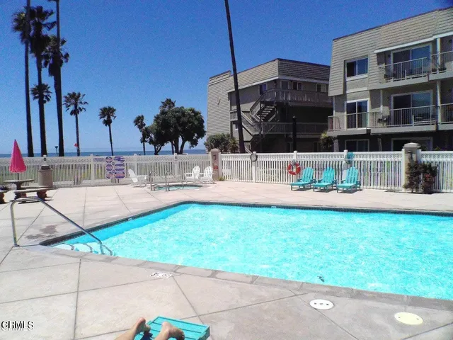 a view of swimming pool with chairs