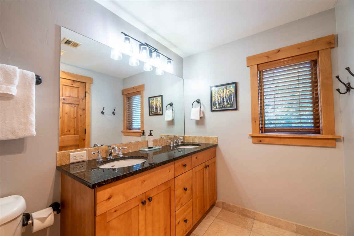 1875 Medicine Springs Road, Unit 4205 Steamboat Springs, CO 80487 - Photo 15 of 43 a bathroom with a sink and a mirror
