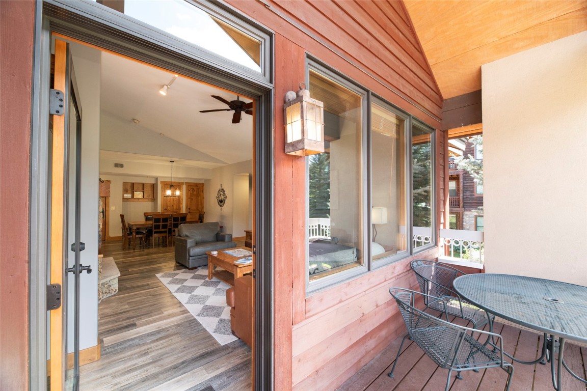 1875 Medicine Springs Road, Unit 4205 Steamboat Springs, CO 80487 - Photo 21 of 43 a view of a balcony with chair and wooden floor
