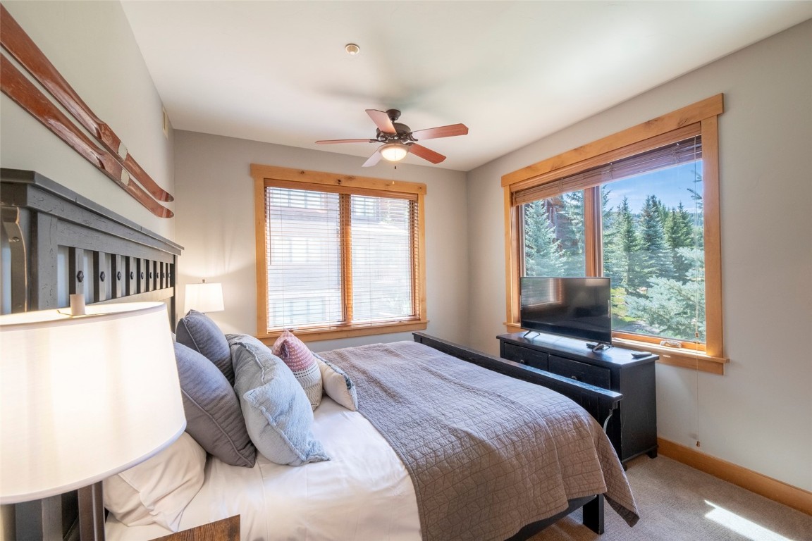 1875 Medicine Springs Road, Unit 4205 Steamboat Springs, CO 80487 - Photo 24 of 43 a bedroom with a bed and a window