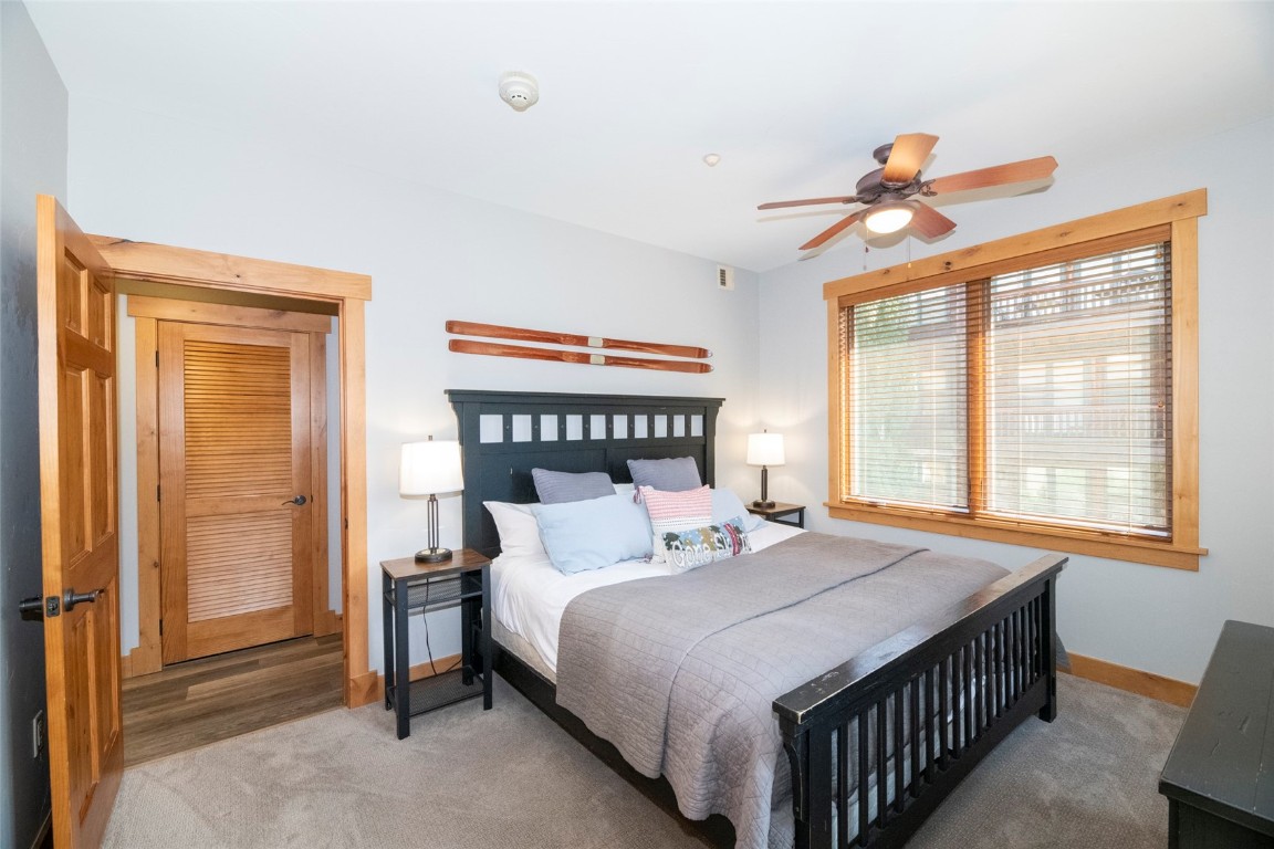 1875 Medicine Springs Road, Unit 4205 Steamboat Springs, CO 80487 - Photo 25 of 43 a bedroom with a bed and a window