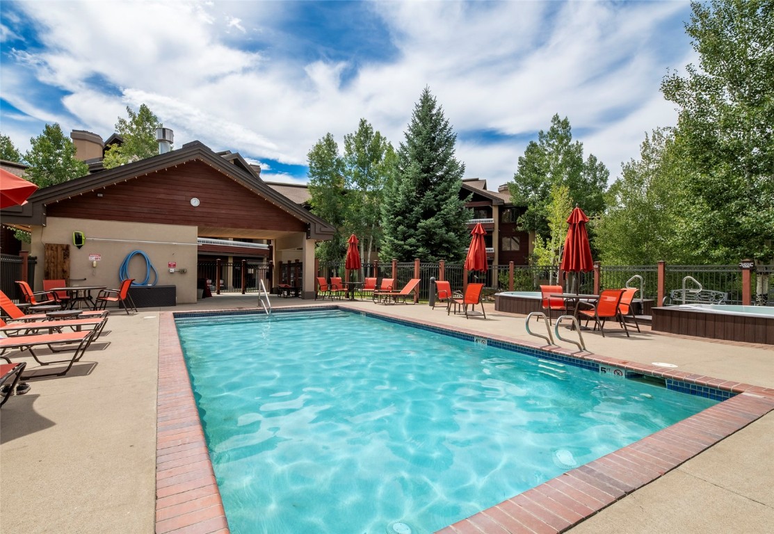 1875 Medicine Springs Road, Unit 4205 Steamboat Springs, CO 80487 - Photo 28 of 43 a view of a house with swimming pool and sitting area