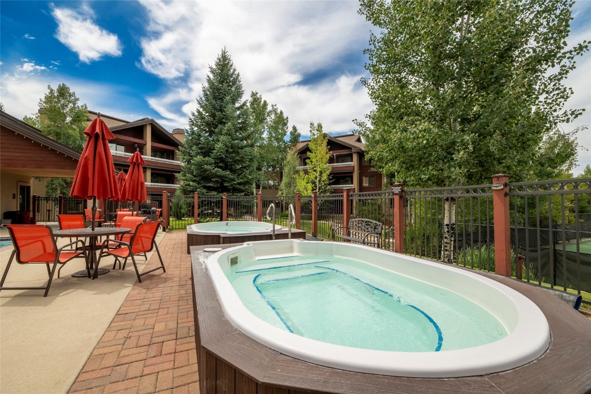 1875 Medicine Springs Road, Unit 4205 Steamboat Springs, CO 80487 - Photo 29 of 43 a view of a swimming pool with sitting area