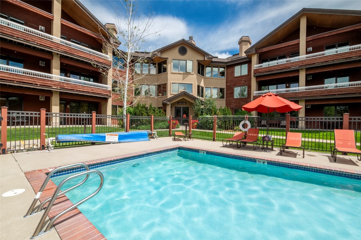 1875 Medicine Springs Road, Unit 4205 Steamboat Springs, CO 80487 - Photo 30 of 43 a view of an apartment with a swimming pool and sitting area
