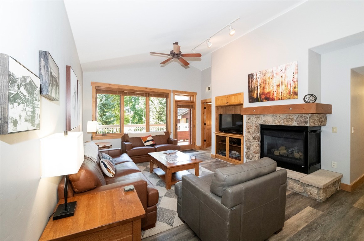 1875 Medicine Springs Road, Unit 4205 Steamboat Springs, CO 80487 - Photo 3 of 43 a living room with furniture fireplace and a large window