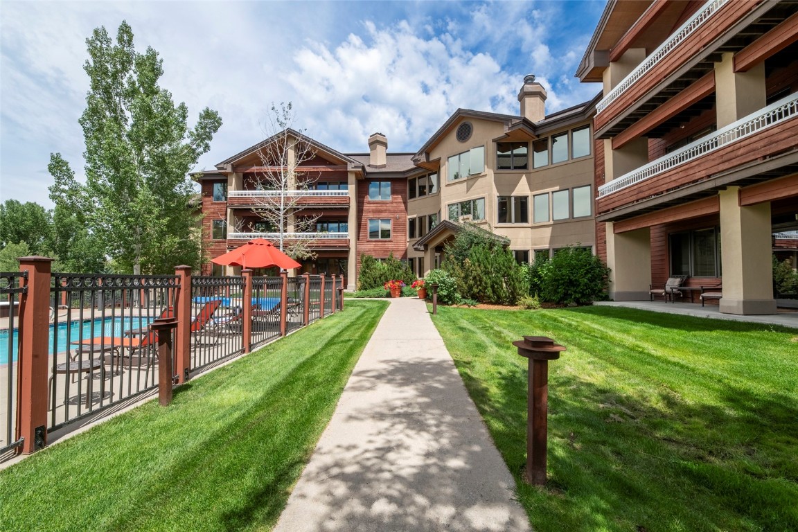 1875 Medicine Springs Road, Unit 4205 Steamboat Springs, CO 80487 - Photo 32 of 43 a front view of house with yard and green space