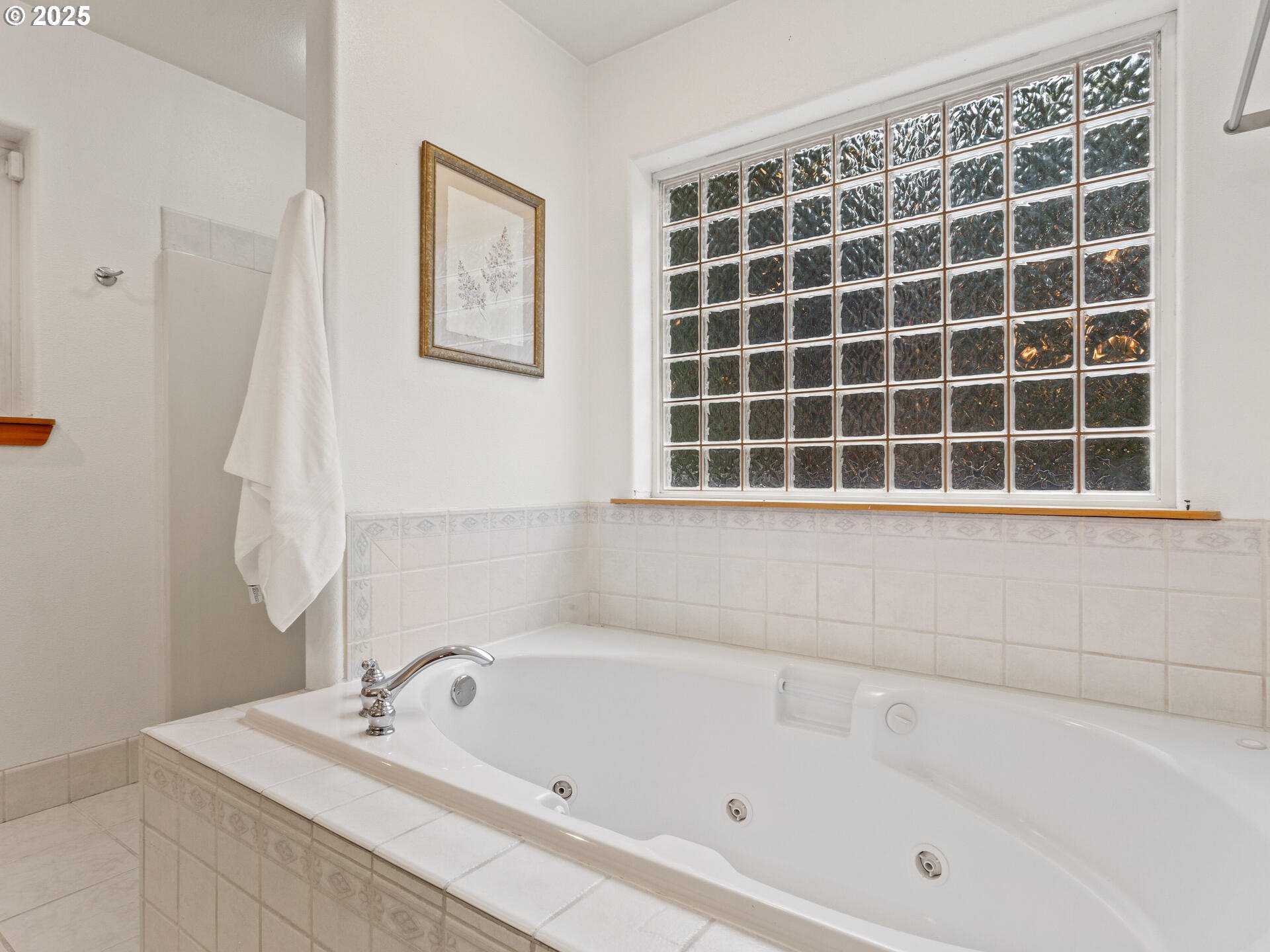 23403 Northeast Canyon Road Battle Ground, WA 98604 - Photo 17 of 48 a bathroom with a bathtub and a shower