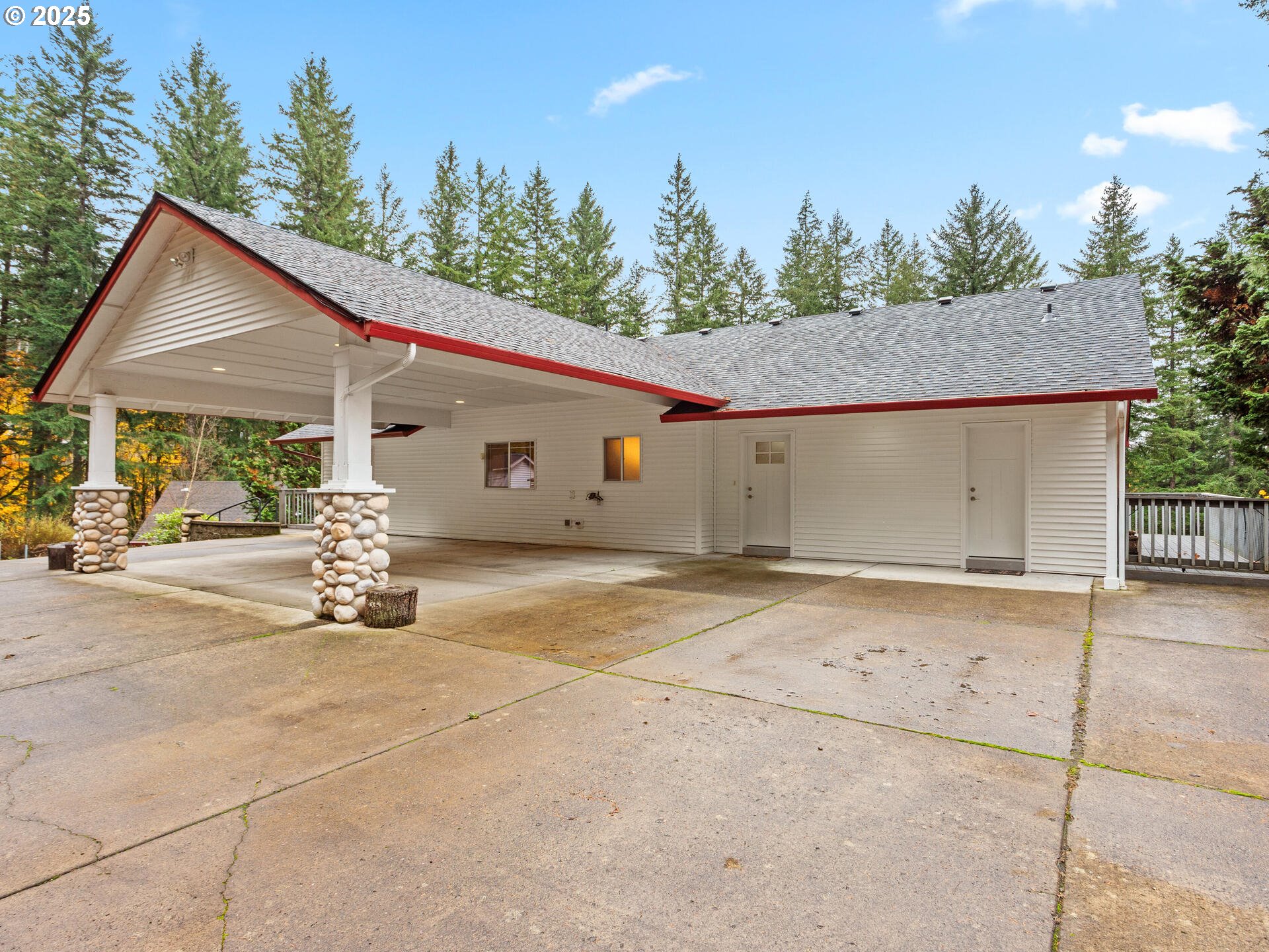 23403 Northeast Canyon Road Battle Ground, WA 98604 - Photo 3 of 48 a view of a house with backyard and trees