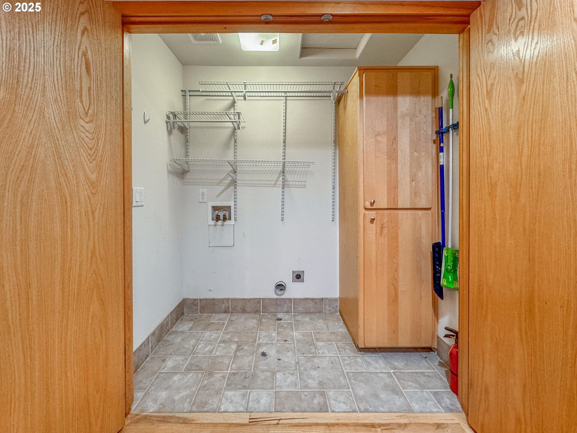 23403 Northeast Canyon Road Battle Ground, WA 98604 - Photo 38 of 48 a view of walk in closet with wooden floor