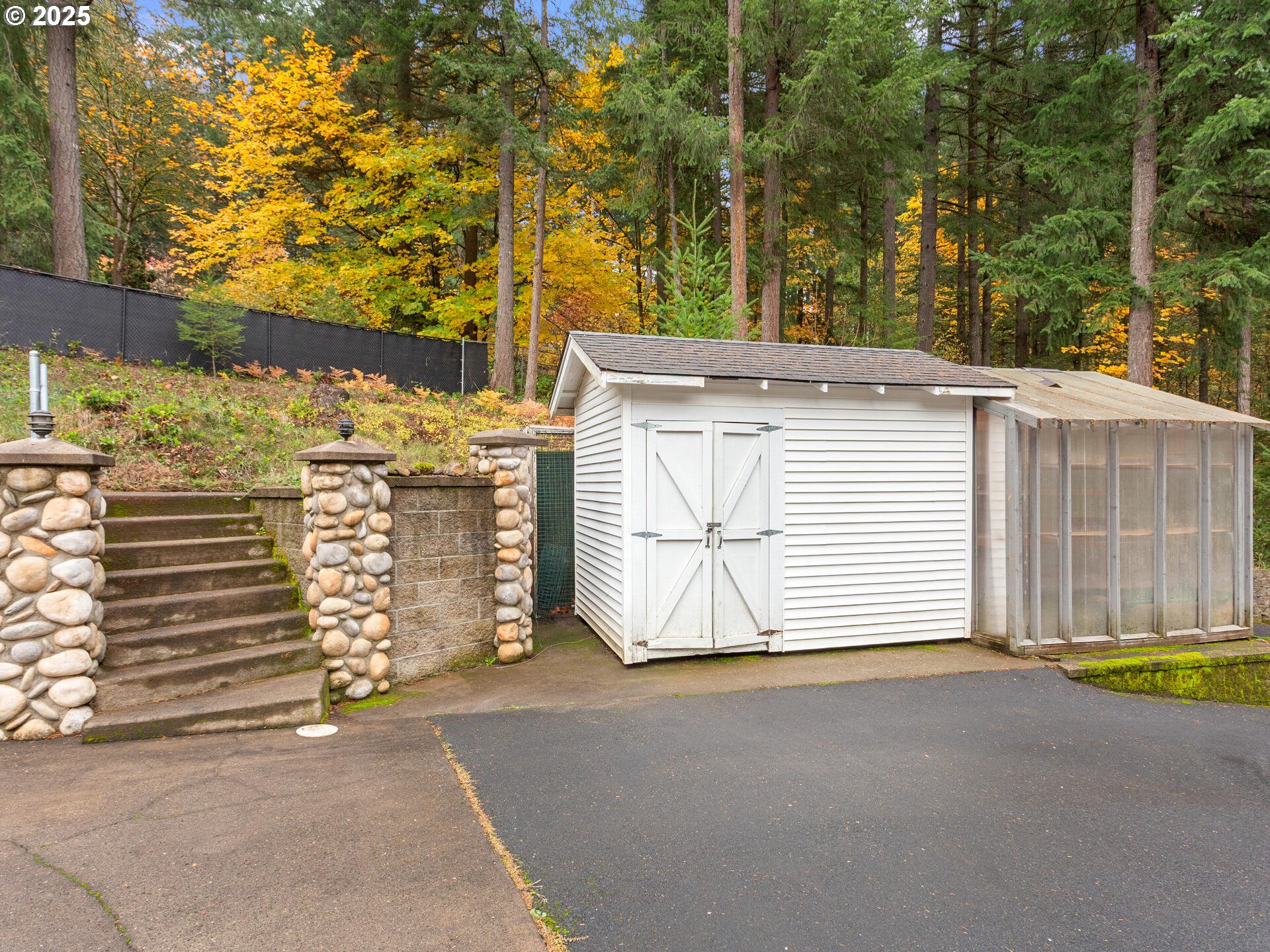 23403 Northeast Canyon Road Battle Ground, WA 98604 - Photo 4 of 48 a view of a house with a garage