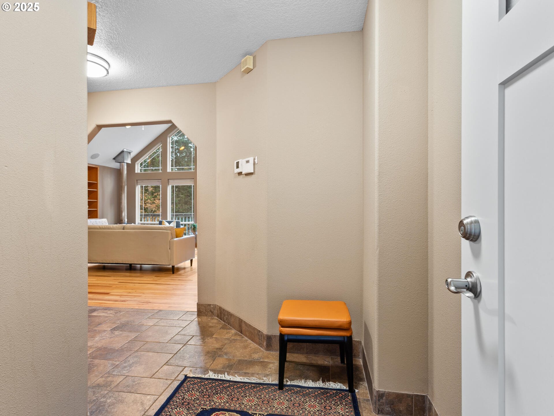 23403 Northeast Canyon Road Battle Ground, WA 98604 - Photo 5 of 48 a view of a bedroom with a bed and wooden floor
