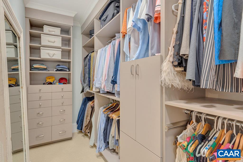 202 Sturbridge Road Charlottesville, VA 22901 - Photo 33 of 49 a view of walk in closet with clothes and shoes